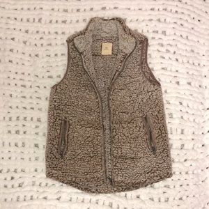 Tan slightly whitewashed vest. Fluffy and soft. Size small.